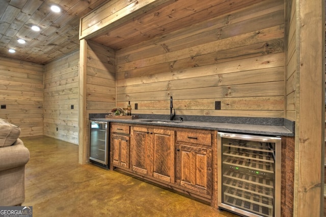 968 Hidden Valley Dr, Morganton, GA 30560 - indoor wet bar with beverage cooler, concrete floors, and wood walls