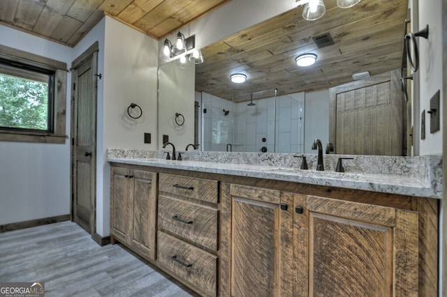 968 Hidden Valley Dr, Morganton, GA 30560 - full bath with wood ceiling, double vanity, wood finished floors, a stall shower, and baseboards