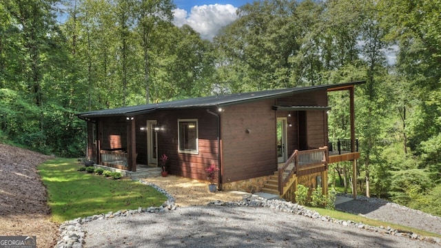 968 Hidden Valley Dr, Morganton, GA 30560 - chalet / cabin with a porch and a view of trees