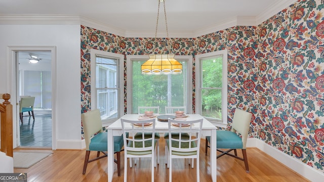 224 Rolling Oaks Dr, Rome, GA 30165 - dining area featuring wallpapered walls, baseboards, crown molding, wood finished floors, and a chandelier