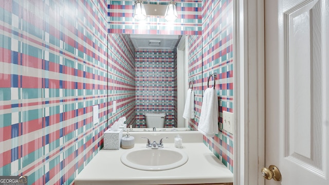 224 Rolling Oaks Dr, Rome, GA 30165 - bathroom featuring wallpapered walls and vanity
