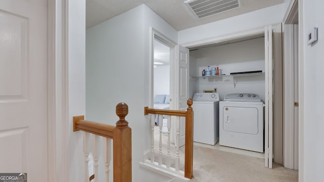 224 Rolling Oaks Dr, Rome, GA 30165 - laundry room featuring washing machine and clothes dryer and light colored carpet