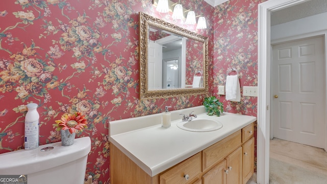 224 Rolling Oaks Dr, Rome, GA 30165 - bathroom with vanity, toilet, and wallpapered walls