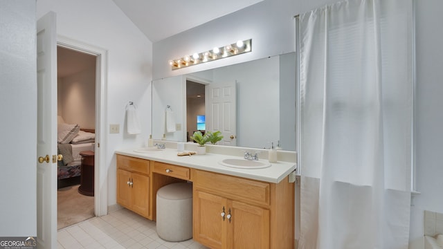 224 Rolling Oaks Dr, Rome, GA 30165 - full bathroom with double vanity, lofted ceiling, ensuite bathroom, and tile patterned floors
