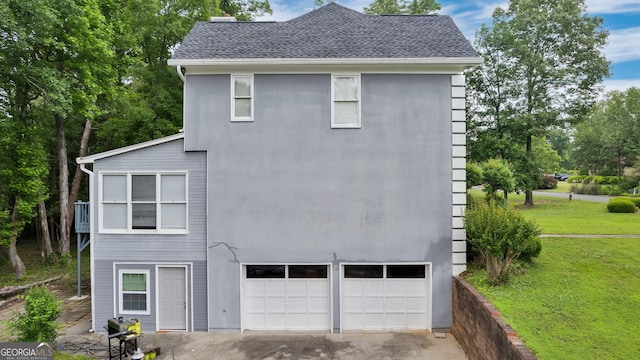 224 Rolling Oaks Dr, Rome, GA 30165 - view of property exterior featuring a garage, a yard, driveway, and roof with shingles