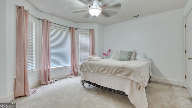 224 Rolling Oaks Dr, Rome, GA 30165 - carpeted bedroom with baseboards and a ceiling fan