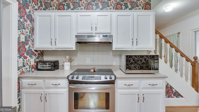 224 Rolling Oaks Dr, Rome, GA 30165 - kitchen featuring electric range, ventilation hood, wallpapered walls, white cabinetry, and tasteful backsplash