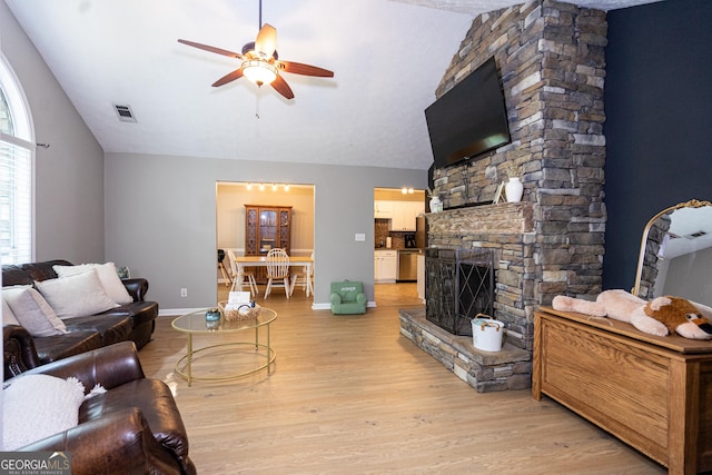 710 Newton Rd, Lagrange, GA 30240 - living area featuring a ceiling fan, light wood finished floors, lofted ceiling, and a fireplace