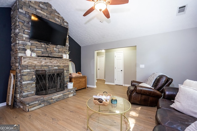 710 Newton Rd, Lagrange, GA 30240 - living area featuring ceiling fan, vaulted ceiling, wood finished floors, and a fireplace