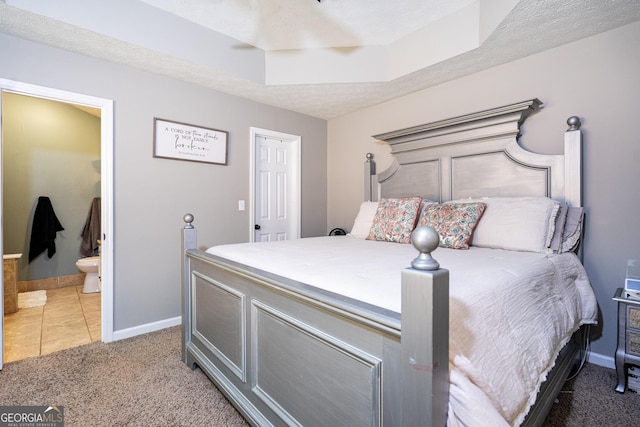 710 Newton Rd, Lagrange, GA 30240 - bedroom featuring connected bathroom, light carpet, and light tile patterned floors