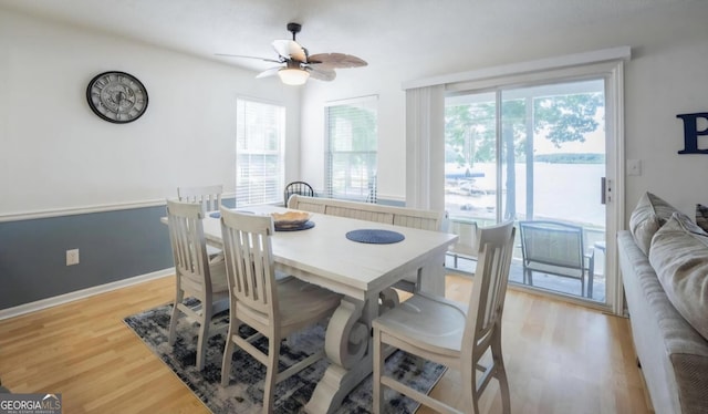 393 Arrowhead Trl, Eatonton, GA 31024 - dining area featuring light wood finished floors, ceiling fan, and baseboards