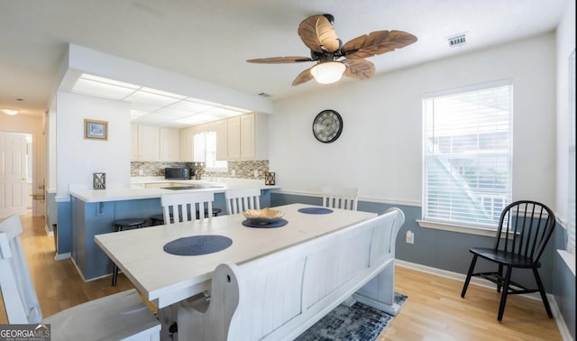 393 Arrowhead Trl, Eatonton, GA 31024 - dining room with light wood-style flooring, healthy amount of natural light, and ceiling fan
