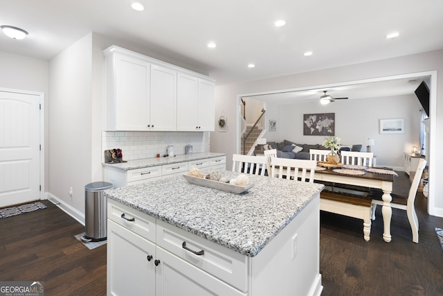 372 Cobblestone Trl, Dallas, GA 30157 - kitchen with dark wood-type flooring, ceiling fan, tasteful backsplash, recessed lighting, and white cabinetry