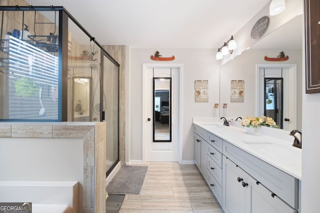 372 Cobblestone Trl, Dallas, GA 30157 - bathroom with double vanity, a stall shower, a bath, and plenty of natural light