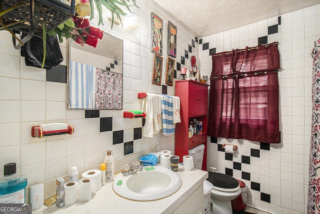 564 Peters St, Statham, GA 30666 - bathroom with tile walls, vanity, a textured ceiling, and tasteful backsplash