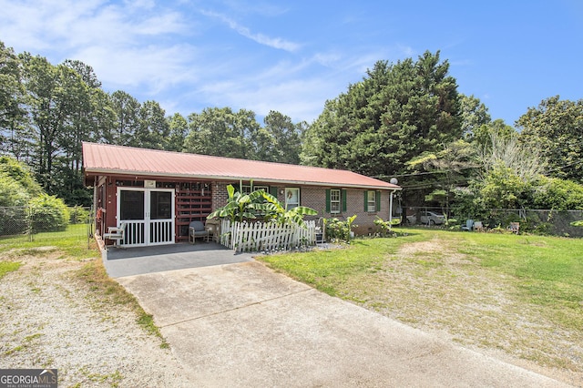 564 Peters St, Statham, GA 30666 - view of front facade featuring concrete driveway and metal roof