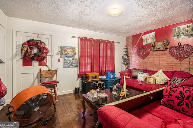 564 Peters St, Statham, GA 30666 - living area featuring a textured ceiling, wood-type flooring, and baseboards