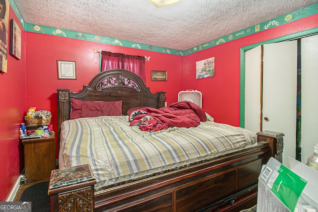 564 Peters St, Statham, GA 30666 - bedroom featuring a textured ceiling and a closet