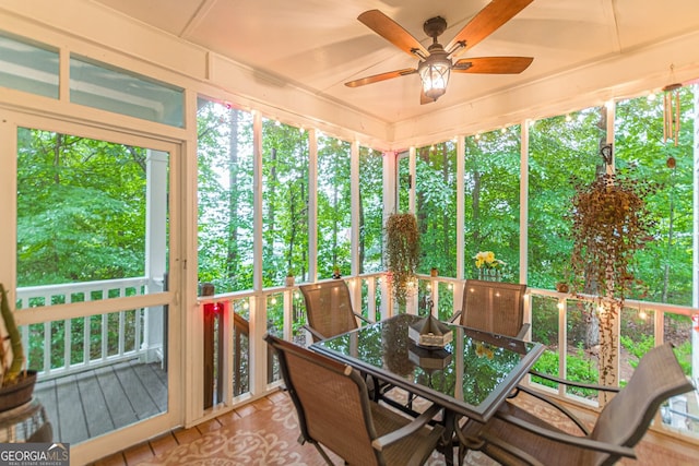 5767 Wembley Dr, Douglasville, GA 30135 - sunroom / solarium with ceiling fan and outdoor dining space