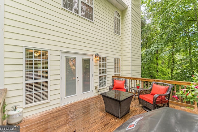 5767 Wembley Dr, Douglasville, GA 30135 - wooden terrace with outdoor lounge area and french doors