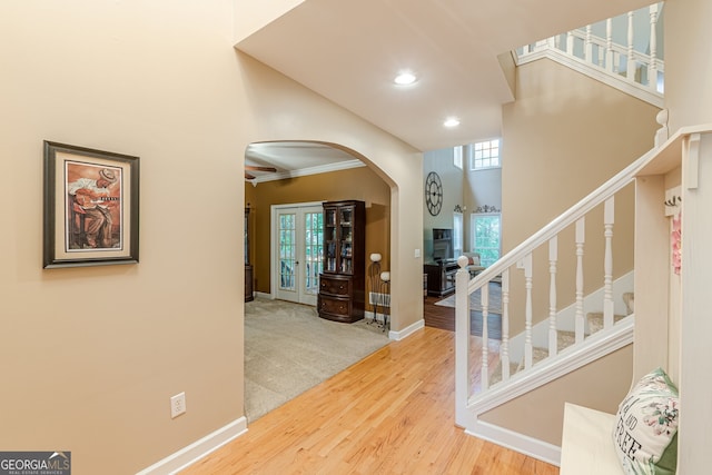 5767 Wembley Dr, Douglasville, GA 30135 - foyer with arched walkways, recessed lighting, wood finished floors, stairs, and a high ceiling