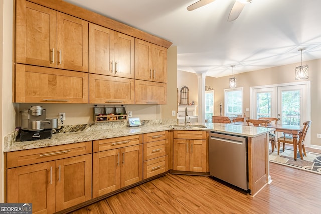 5767 Wembley Dr, Douglasville, GA 30135 - kitchen featuring stainless steel dishwasher, light wood-type flooring, a peninsula, ornate columns, and a ceiling fan