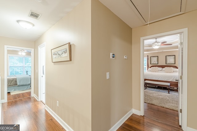 5767 Wembley Dr, Douglasville, GA 30135 - hallway with attic access and wood finished floors
