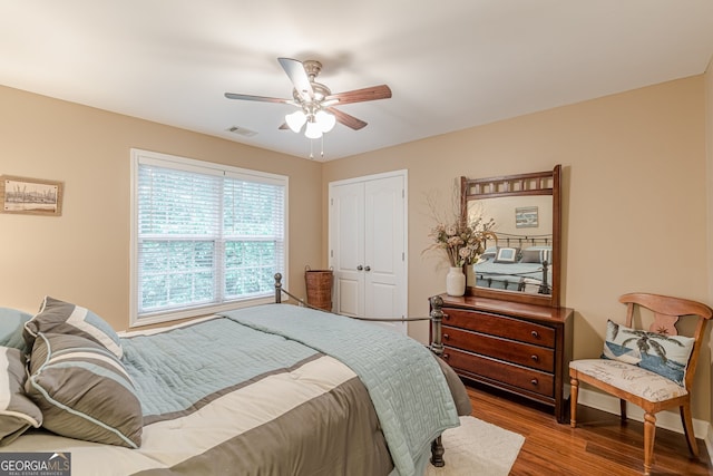 5767 Wembley Dr, Douglasville, GA 30135 - bedroom featuring wood finished floors, a closet, and ceiling fan