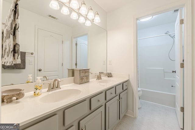 5767 Wembley Dr, Douglasville, GA 30135 - bathroom featuring double vanity and shower / bathtub combination