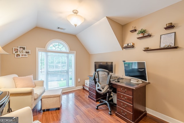5767 Wembley Dr, Douglasville, GA 30135 - office area featuring wood finished floors and vaulted ceiling