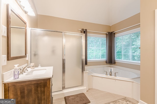 5767 Wembley Dr, Douglasville, GA 30135 - bathroom featuring vanity, a shower stall, a bath, and tile patterned flooring