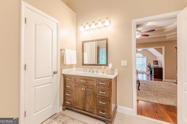 5767 Wembley Dr, Douglasville, GA 30135 - bathroom with ceiling fan, vanity, and crown molding