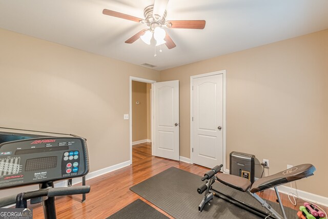 5767 Wembley Dr, Douglasville, GA 30135 - workout room featuring light wood-style flooring and a ceiling fan