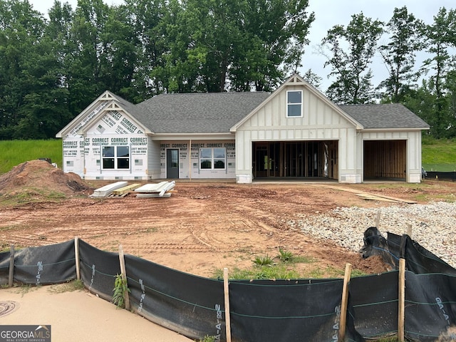 60 Barnwood Ct, Dallas, GA 30132 - view of front facade featuring board and batten siding, an attached garage, driveway, and roof with shingles