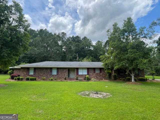404 S Baker St, Glennville, GA 30427 - ranch-style home featuring a front yard and brick siding