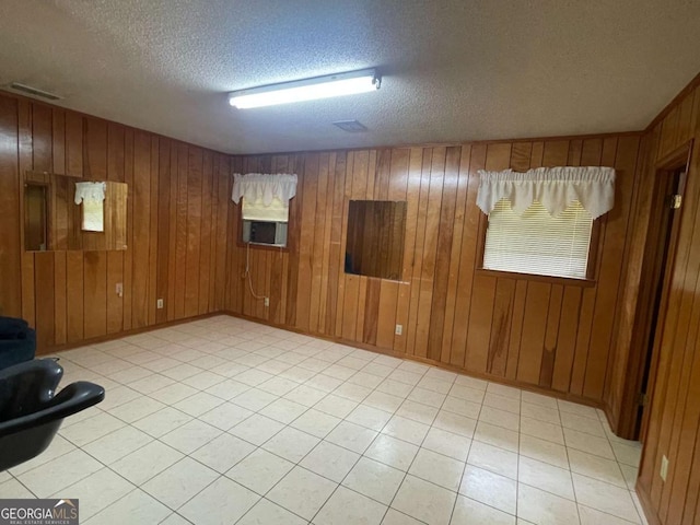 404 S Baker St, Glennville, GA 30427 - spare room with a textured ceiling and wooden walls