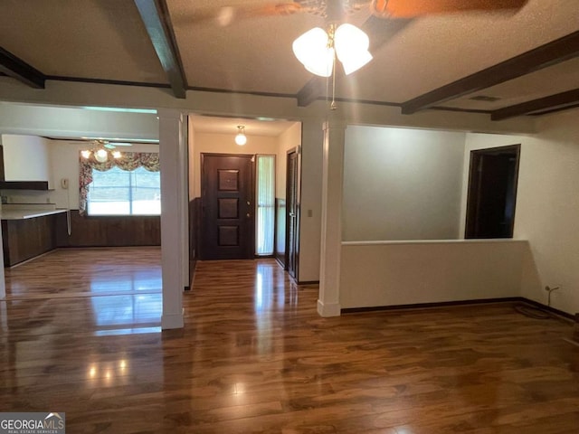 404 S Baker St, Glennville, GA 30427 - empty room featuring a ceiling fan, wood finished floors, beam ceiling, and baseboards