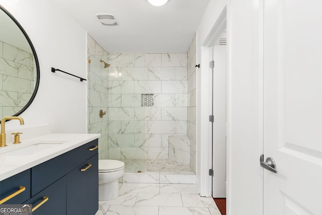 3324 Peachtree Rd NE Unit 1813, Atlanta, GA 30305 - bathroom featuring marble look tile flooring, vanity, and a tile shower