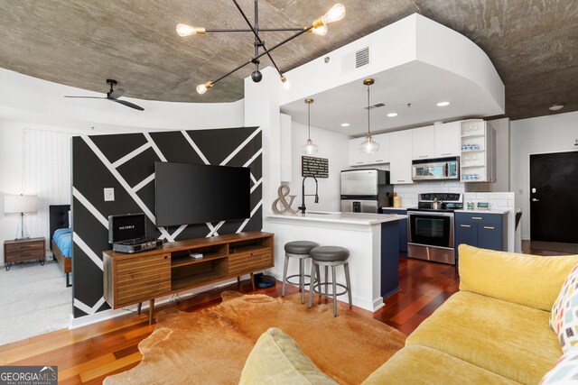 3324 Peachtree Rd NE Unit 1813, Atlanta, GA 30305 - living area with wood finished floors, ceiling fan, and recessed lighting