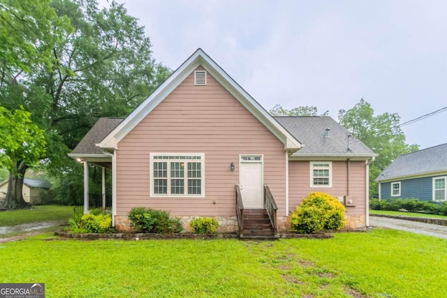 2378 Randall Ave, Lithonia, GA 30058 - bungalow-style home featuring entry steps, a front yard, and roof with shingles