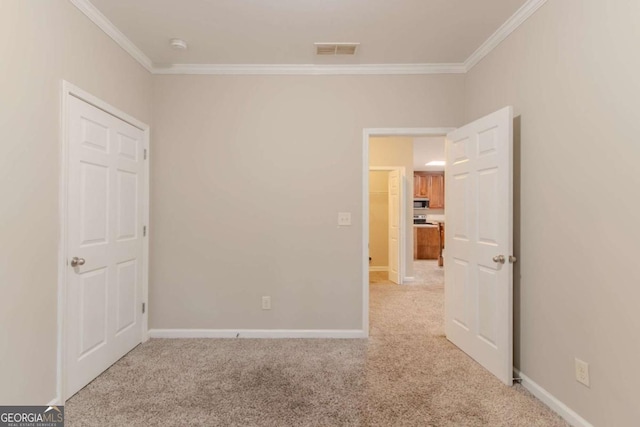 2378 Randall Ave, Lithonia, GA 30058 - unfurnished bedroom featuring ornamental molding, light carpet, and baseboards