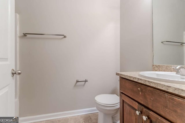 2378 Randall Ave, Lithonia, GA 30058 - bathroom with vanity, toilet, and baseboards
