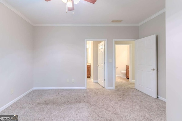2378 Randall Ave, Lithonia, GA 30058 - unfurnished bedroom featuring crown molding, light colored carpet, baseboards, ensuite bath, and ceiling fan