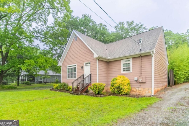 2378 Randall Ave, Lithonia, GA 30058 - bungalow-style house featuring a front lawn and roof with shingles