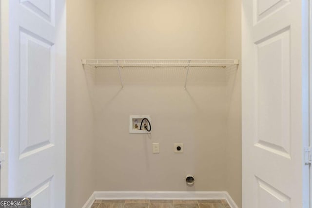 2378 Randall Ave, Lithonia, GA 30058 - laundry room featuring electric dryer hookup, hookup for a washing machine, and baseboards