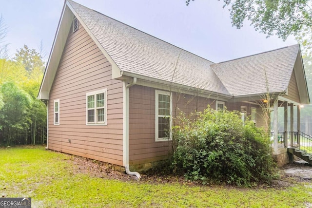 2378 Randall Ave, Lithonia, GA 30058 - view of home's exterior with a shingled roof and a yard