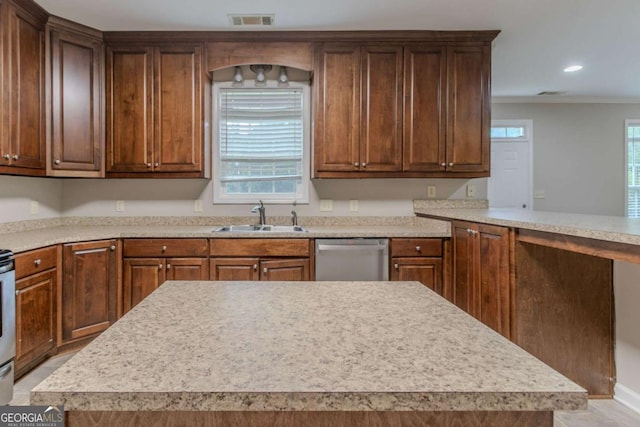 2378 Randall Ave, Lithonia, GA 30058 - kitchen featuring stainless steel dishwasher, a sink, light countertops, ornamental molding, and recessed lighting