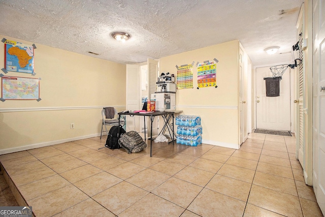 6433 Stone Ter, Morrow, GA 30260 - dining space featuring light tile patterned floors, baseboards, and a textured ceiling