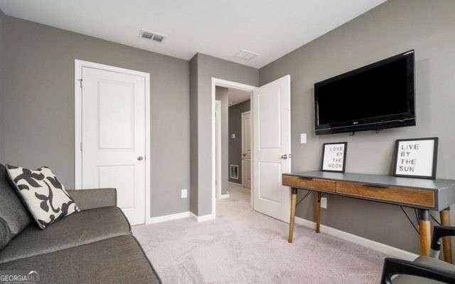 268 Rydal Way, Winder, GA 30680 - living room with light carpet and baseboards