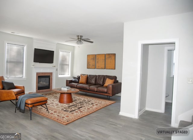 3700 Newhalem St SW, Atlanta, GA 30331 - living area with wood finished floors, ceiling fan, and a fireplace with flush hearth